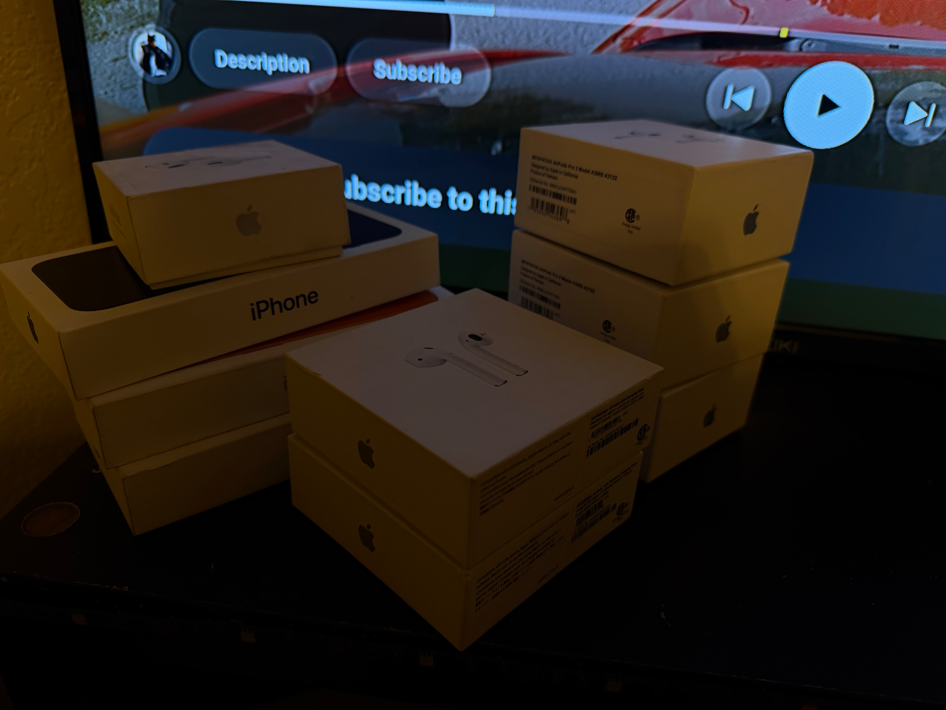 Reseller haul of sealed iPhone and AirPods boxes from the electronics vendor bundle